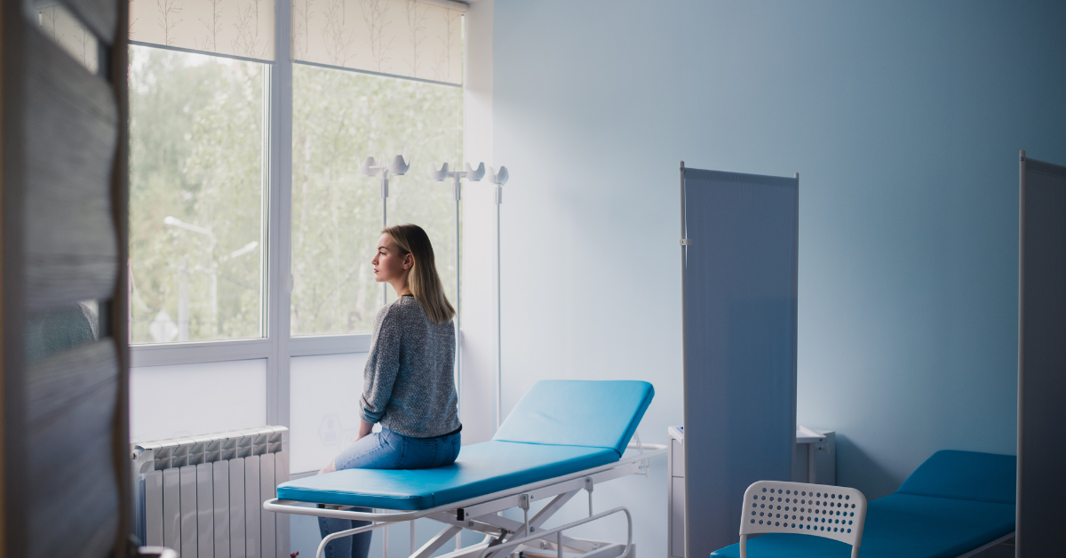 patient sits on chair and contemplates beliefs